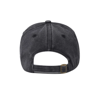 Detail view of the adjustable brass metal buckle and washed fabric on a gray baseball cap