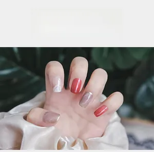 5D embossed nail stickers featuring red, nude gold, and grey marble patterns on hand
