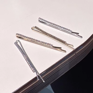 Set of four sparkling rhinestone bobby pins in silver gold and rose gold finishes