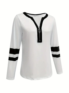 Detail of V-neck zipper with silver ring pull and black stripes on white sweatshirt