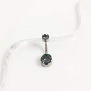 Macro detail of G23 titanium belly ring with iridescent bezel-set cubic zirconia gems