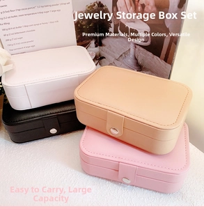 Stack of four portable faux leather jewelry boxes in white, black, beige, and pink colors
