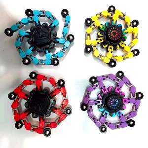 Set of four colorful transformable chain fidget spinners in blue yellow red and purple