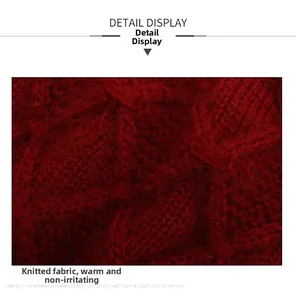Detailed macro view of dark red chunky knit fabric with thick diamond textured patterns