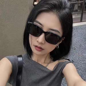 Chic black oversized square sunglasses for women with UV protection on female model