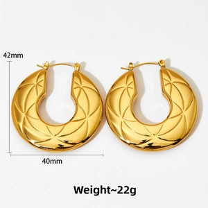Macro shot of gold chunky hoop earrings with radial texture, size 42mm by 40mm