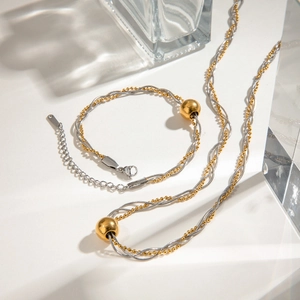 Detailed set of two-tone twisted chain necklace and bracelet with gold spherical beads