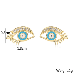 Detail view of gold eye earrings with 18K plating, zircon, blue enamel and dimensions