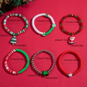 Set of 6 Christmas themed stretch bracelets with festive charms and 5.5cm inner diameter