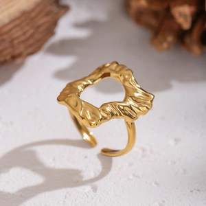 Irregular lava textured hollow geometric ring in gold finish with an adjustable open band