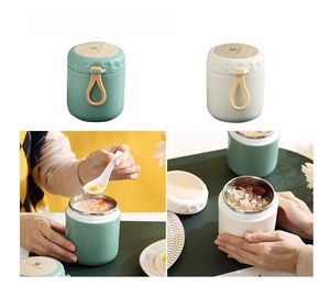 Detail of 304 stainless steel insulated soup cup with wood-grain lid and silicone handle