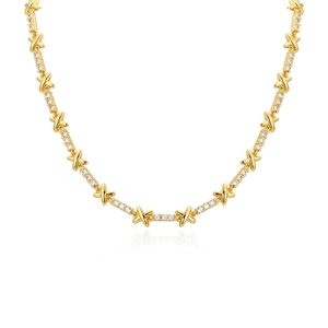 Elegant gold plated X-shaped link necklace with zircon stones on white background