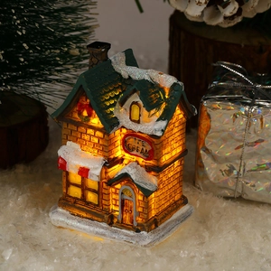 Macro detail of glowing resin Christmas ice cream shop with LED lights and snow texture