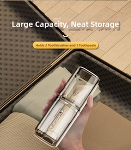 Portable travel toothbrush holder kit shown in hand with luggage background scene