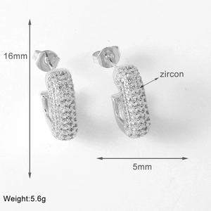 Detailed view of geometric zircon earrings measuring 16mm in height and 5mm in width