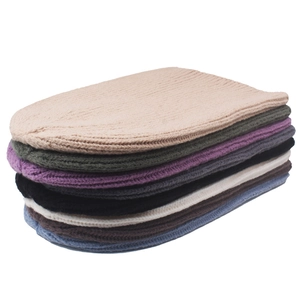 Unisex knit beanie caps in various solid colors including beige and grey