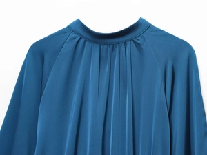 Close-up of high-quality navy blue satin fabric with a silky smooth texture and subtle gloss