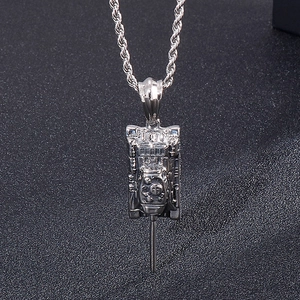 Detailed close-up of a silver punk tank pendant on a twisted rope chain necklace