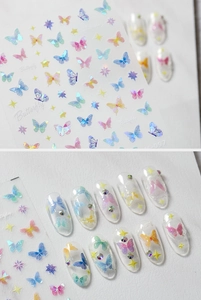 Detail of 5D embossed butterfly nail art stickers with iridescent holographic finish