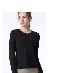 Detail of black quick-dry long sleeve sports top showing slim fit cut and seam stitching