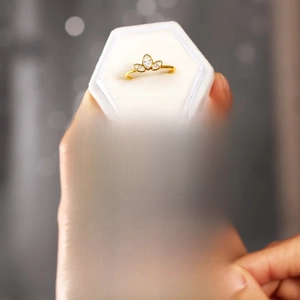 Gold clover ring with marquise stones in a velvet box with a sentimental Mother's Day card
