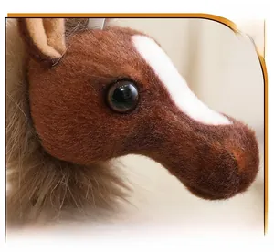 Macro detail of plush horse pendant showing soft brown fur and realistic eye texture