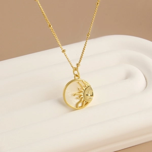 18k gold plated sunburst necklace with mother of pearl inlay and a sleek gold chain
