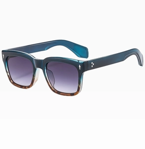 Detail of square sunglasses featuring blue and tortoiseshell frames with star rivet accents