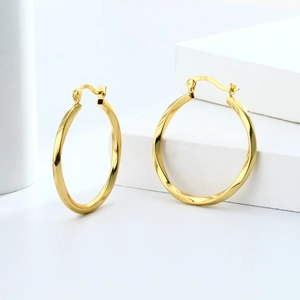 Detailed view of gold-plated S925 sterling silver hoop earrings with twisted texture design