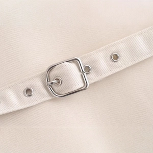 Beige tube dress with twill fabric texture, matching belt and silver metal eyelets