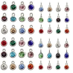 Detailed view of colorful birthstone glass pendants in silver alloy for DIY jewelry