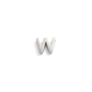 Macro shot of a silver vintage 10mm stainless steel letter W pendant charm