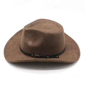 Detail of dark brown western cowboy hat featuring black leather band and gold metal buckle