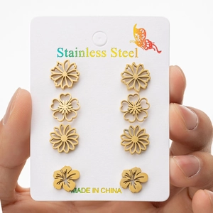 Set of four gold-plated stainless steel flower stud earrings with daisy designs