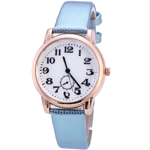 Minimalist women's quartz watch with light blue snakeskin strap and rose gold metal case