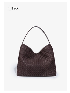 Detail view showing the classic woven leather texture and back design of a brown tote bag