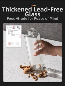 Close-up of thickened lead-free glass oil bottle with threaded neck on stone counter