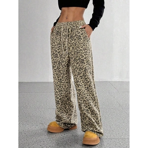 Detail view of high waist leopard print wide leg pants with adjustable drawstring waistband
