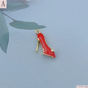 Detail of red enamel high heel shoe charm for DIY jewelry measuring 8.6 by 18.2 mm