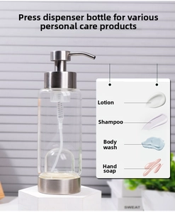 Macro detail of the stainless steel pump head and glass bottle for liquid cosmetics