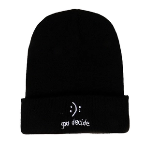 Unisex black knit beanie featuring white embroidered smile emoji and you decide text