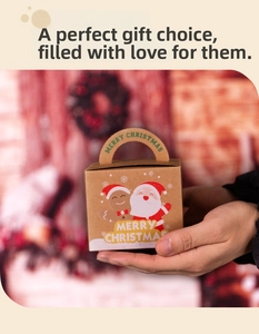 Detail of kraft paper Christmas gift box featuring Santa Claus and gingerbread man illustrations