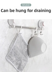Silver wire kitchen cloth hanging on a wall-mounted rack for fast drainage and drying