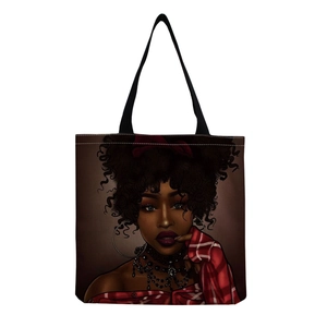 Detailed view of canvas tote bag featuring an artistic African woman portrait print