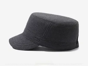 Detail view of the deep gray cadet cap showing wool fabric texture and metal logo