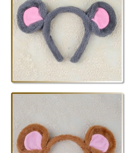 Detail of plush gray and brown mouse ears headband with soft texture on lace fabric