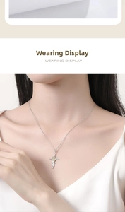 Close-up of S925 sterling silver sunflower cross necklace worn by a female model
