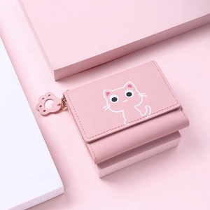 Pink cartoon cat wallet detail with cat paw zipper pull and compact tri-fold design