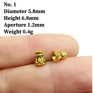 Detail of vintage gold tassel cap bead showing exact dimensions and 5.8mm diameter size