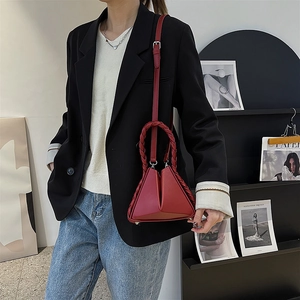 Red geometric triangle leather handbag with thick braided handle and shoulder strap